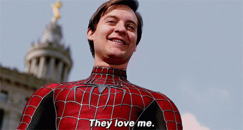 A Man In A Spiderman Costume Is Smiling And Says They Love Me GIF