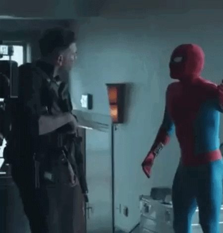 A Man In A Spiderman Costume Is Standing Next To Another Man In A Spiderman Costume . GIF