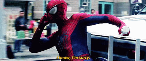 A Man In A Spiderman Costume Is Talking On A Cell Phone GIF