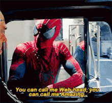A Man In A Spiderman Costume Is Talking To Another Man . GIF