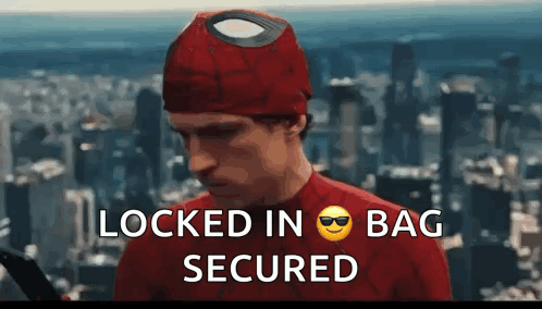 A Man In A Spiderman Costume With The Words Locked In Bag Secured Written Below Him GIF