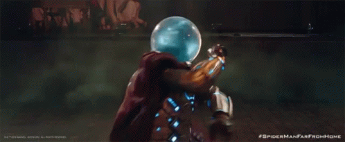 A Man In A Spiderman From Home Costume Is Holding A Green Object GIF