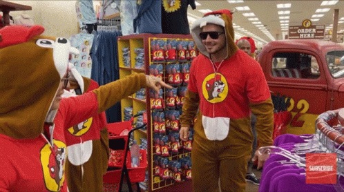 A Man In A Squirrel Costume Points At Something GIF