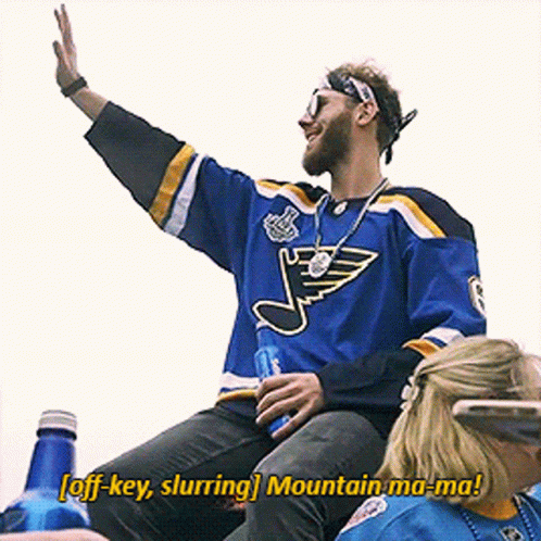 A Man In A St. Louis Blues Jersey Says Off Key Slurring Mountain Ma-Ma! GIF