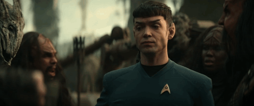 A Man In A Star Trek Uniform With An A On His Chest GIF