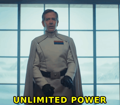 A Man In A Star Wars Uniform Stands In Front Of A Window With The Words Unlimited Power Written Below Him GIF