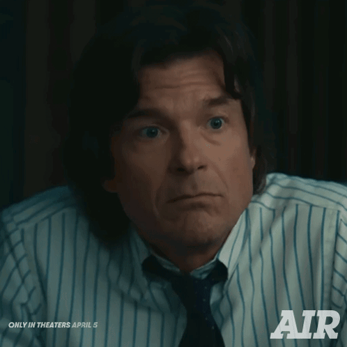 A Man In A Striped Shirt And Tie Is Advertising Air GIF
