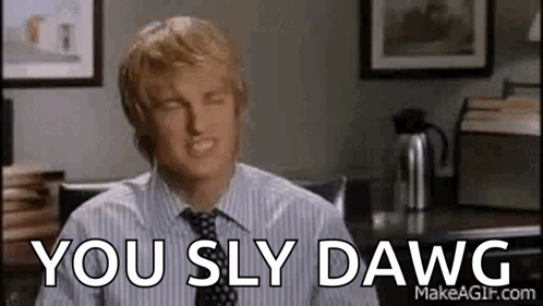 Man In Striped Shirt And Tie Sitting At Desk GIF