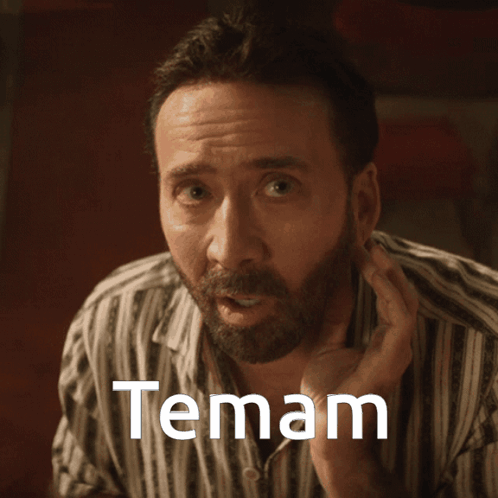 A Man In A Striped Shirt Has The Word Temam Written On His Face GIF