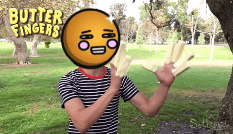 a man in a striped shirt is holding butter fingers