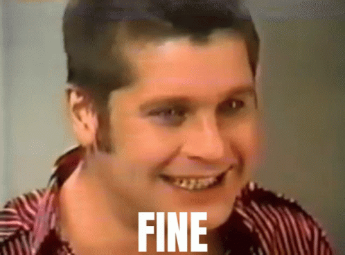 A Man In A Striped Shirt Is Smiling With The Word Fine On His Face GIF