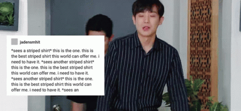 A Man In A Striped Shirt Is Standing Next To Another Man In A Black Shirt .. GIF