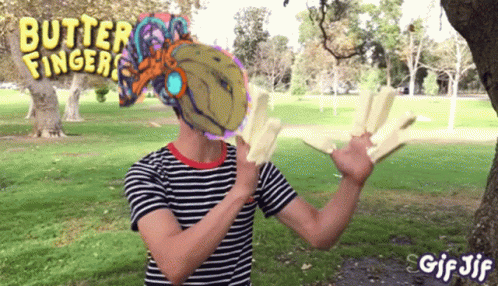 a man in a striped shirt with butter fingers on his shirt