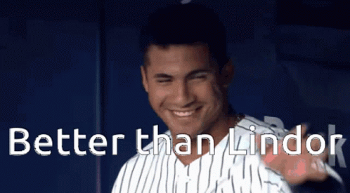 A Man In A Striped Shirt With The Words Better Than Lindor Behind Him GIF