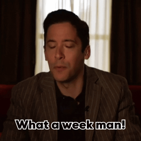 A Man In A Striped Suit Says What A Week Man GIF