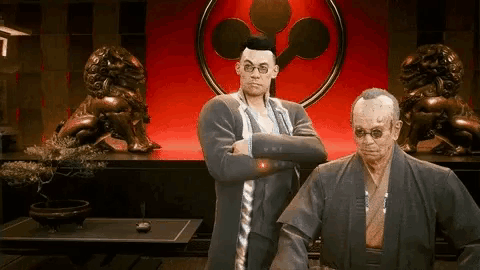 A Man In A Suit And A Man In A Kimono Are Standing Next To Each Other . GIF