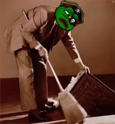 A Man In A Suit And A Pirate Hat Is Sweeping The Floor . GIF