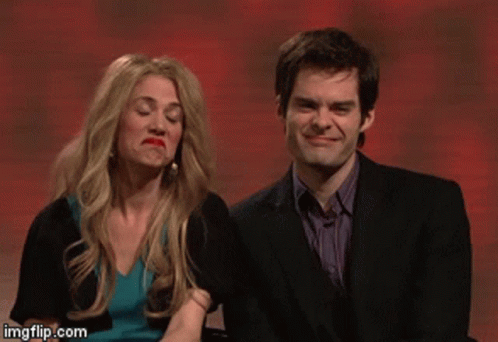 A Man In A Suit And A Woman In A Blue Dress Are Sitting Next To Each Other With Imgflip.com At The Bottom GIF