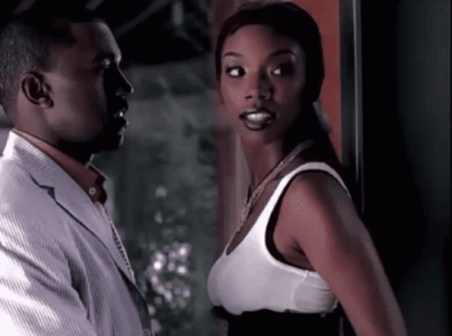 Man In Suit And Woman In White Tank Top GIF