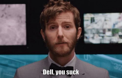 A Man In A Suit And Bow Tie Is Saying " Dell You Suck " GIF