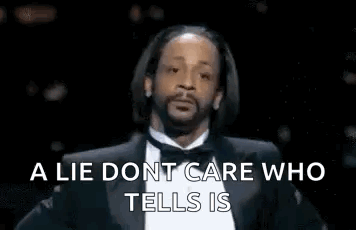 A Man In A Suit And Bow Tie Is Talking About A Lie Dont Care Who Tells Is . GIF