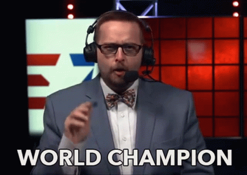 A Man In A Suit And Bow Tie Says " World Champion " GIF