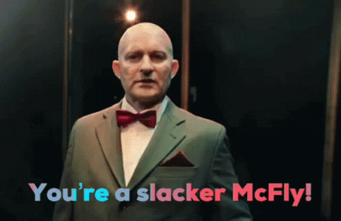A Man In A Suit And Bow Tie With The Words You 'Re A Slacker Mcfly GIF