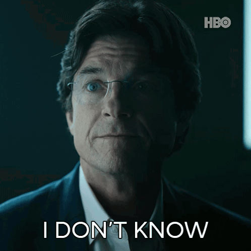 A Man In A Suit And Glasses Says I Don T Know GIF