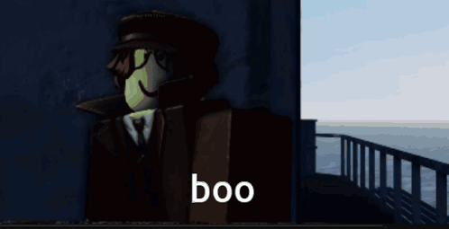 A Man In A Suit And Hat Says Boo GIF