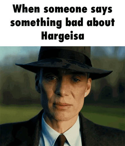 A Man In A Suit And Hat Says Something Bad About Hargeisa GIF