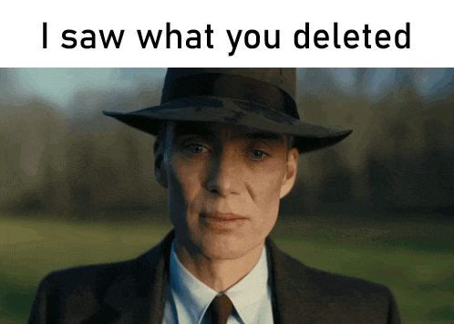 A Man In A Suit And Hat With The Words " I Saw What You Deleted " Above Him GIF