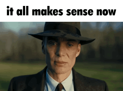 A Man In A Suit And Hat With The Words " It All Makes Sense Now " Below Him GIF