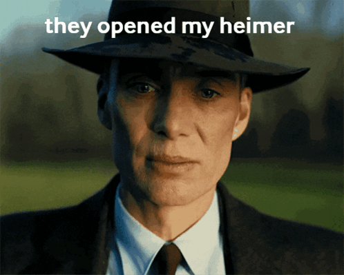 A Man In A Suit And Hat With The Words They Opened My Heimer On The Bottom GIF