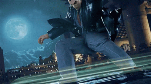 A Man In A Suit And Leather Jacket Is Jumping In The Air With A Full Moon In The Background GIF