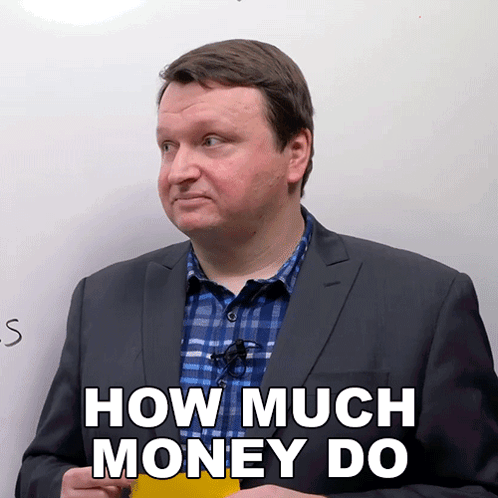 A Man In A Suit And Plaid Shirt Is Holding A Yellow Sticky Note That Says How Much Money Do GIF