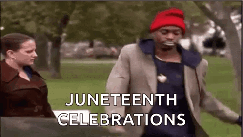 A Man In A Suit And Red Hat Is Dancing In A Park . GIF
