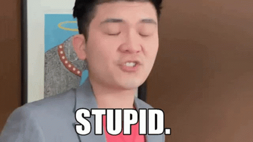A Man In A Suit And Red Shirt Says Stupid GIF