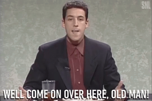 A Man In A Suit And Red Shirt Says Well Come On Over Here Old Man . GIF