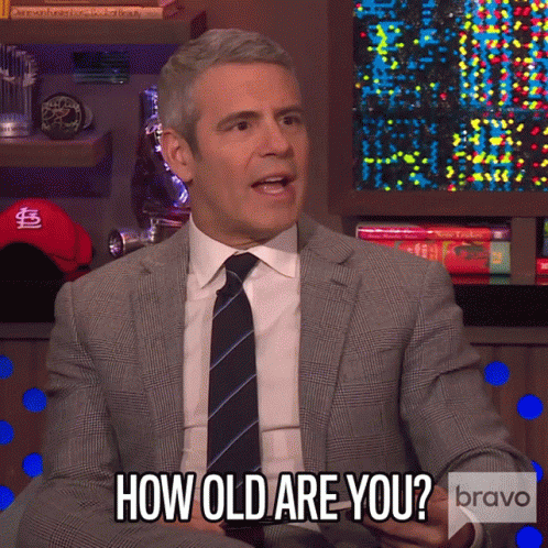 a man in a suit and tie asking how old are you