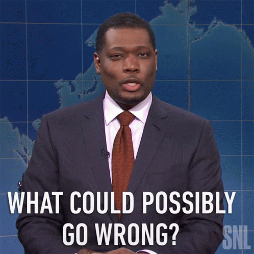 A Man In A Suit And Tie Asks What Could Possibly Go Wrong GIF