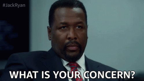 A Man In A Suit And Tie Asks " What Is Your Concern " GIF