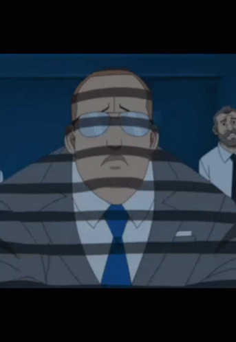 A Man In A Suit And Tie Behind Bars With A Striped Face GIF
