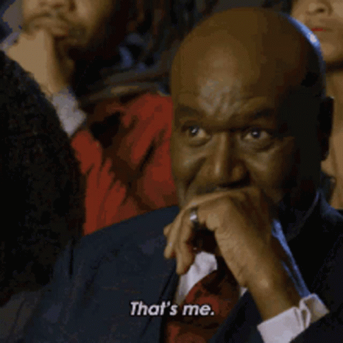 Man In Suit Covering Mouth Says That's Me GIF