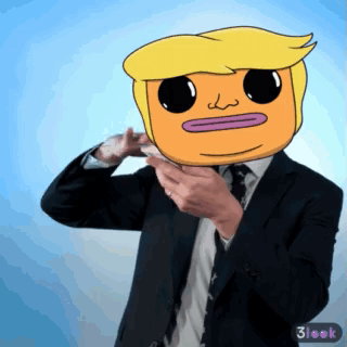 A Man In A Suit And Tie Has A Cartoon Face On His Face GIF