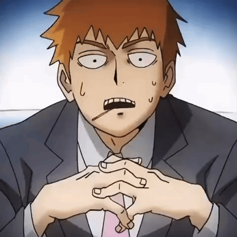 A Man In A Suit And Tie Has A Cigarette In His Mouth GIF