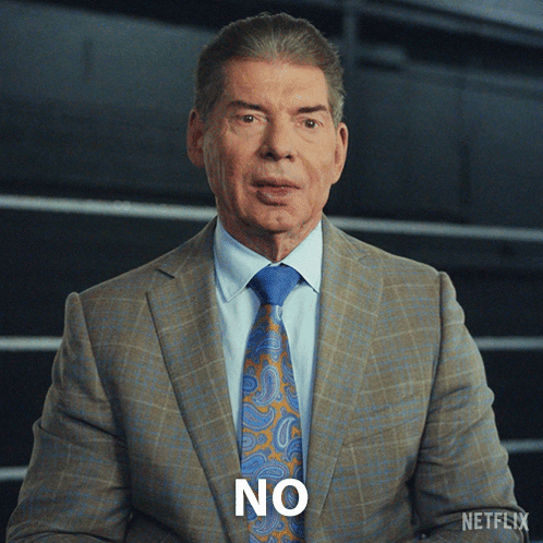 A Man In A Suit And Tie Has The Word No On His Face GIF