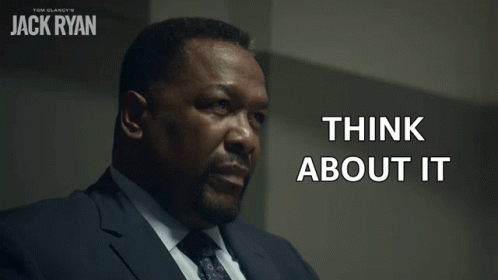 A Man In A Suit And Tie Has The Words Think About It Written On His Face GIF