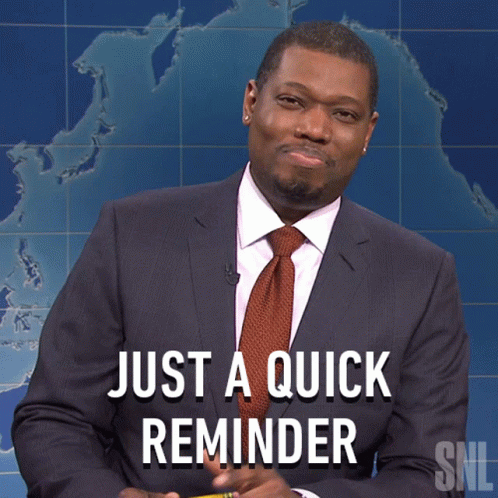 A Man In A Suit And Tie Holds A Pencil In Front Of A Sign That Says Just A Quick Reminder GIF