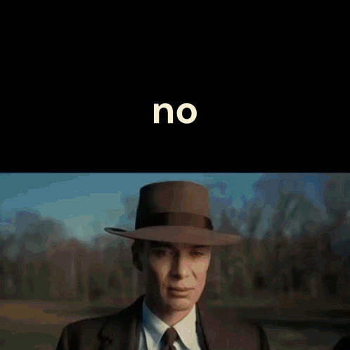 A Man In A Suit And Tie Holds His Hand To His Forehead In Front Of A Black Background With The Word No On It GIF
