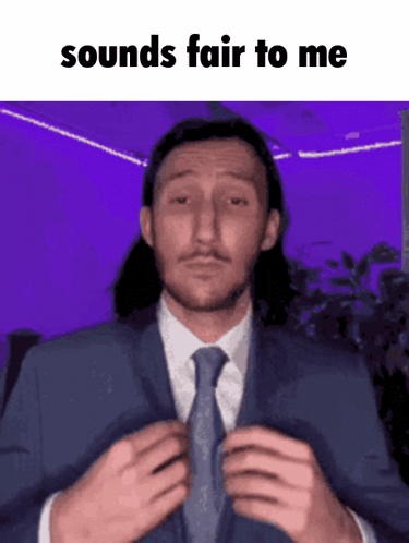 A Man In A Suit And Tie Is Adjusting His Tie With The Words Sounds Fair To Me Below Him GIF